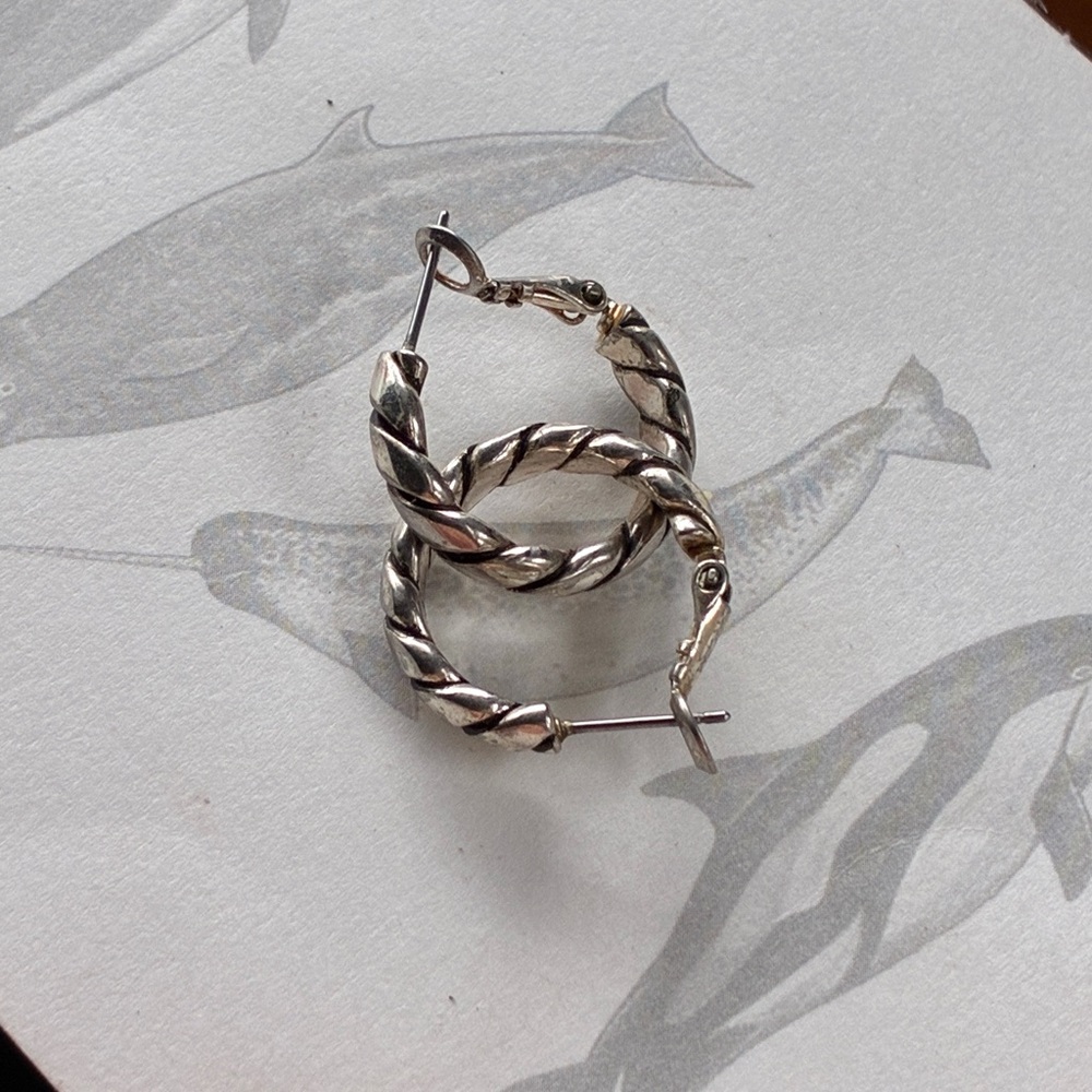 Silver tone braided hoop earrings. 1” hoops (approx.)